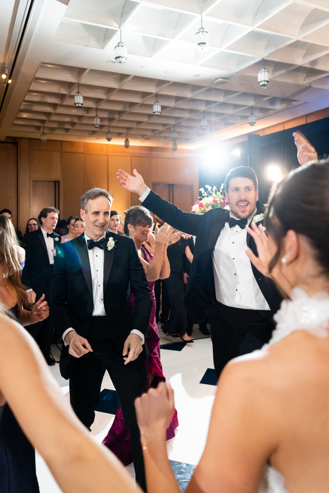 Second-dress reveal in the art-filled Crescent Hotel hallway, Fort Worth wedding