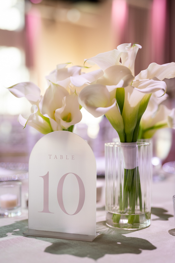 Wedding party portraits in white, green, and pink