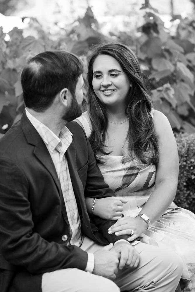 Sarah and Mitchell surrounded by lush greenery in Highland Park, Dallas