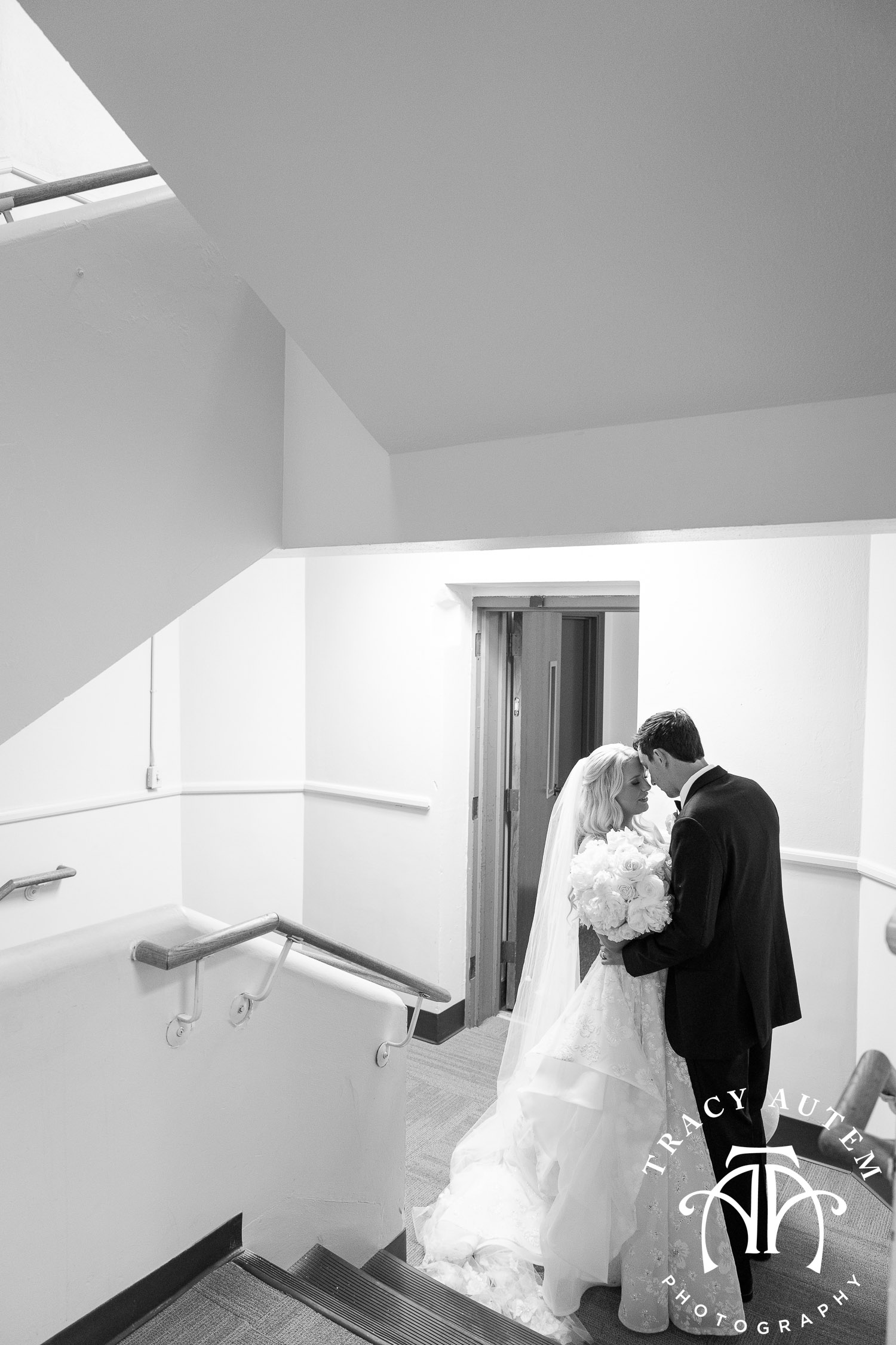 first moments as a married couple husband wife in church stairwell by Tracy Autem photography