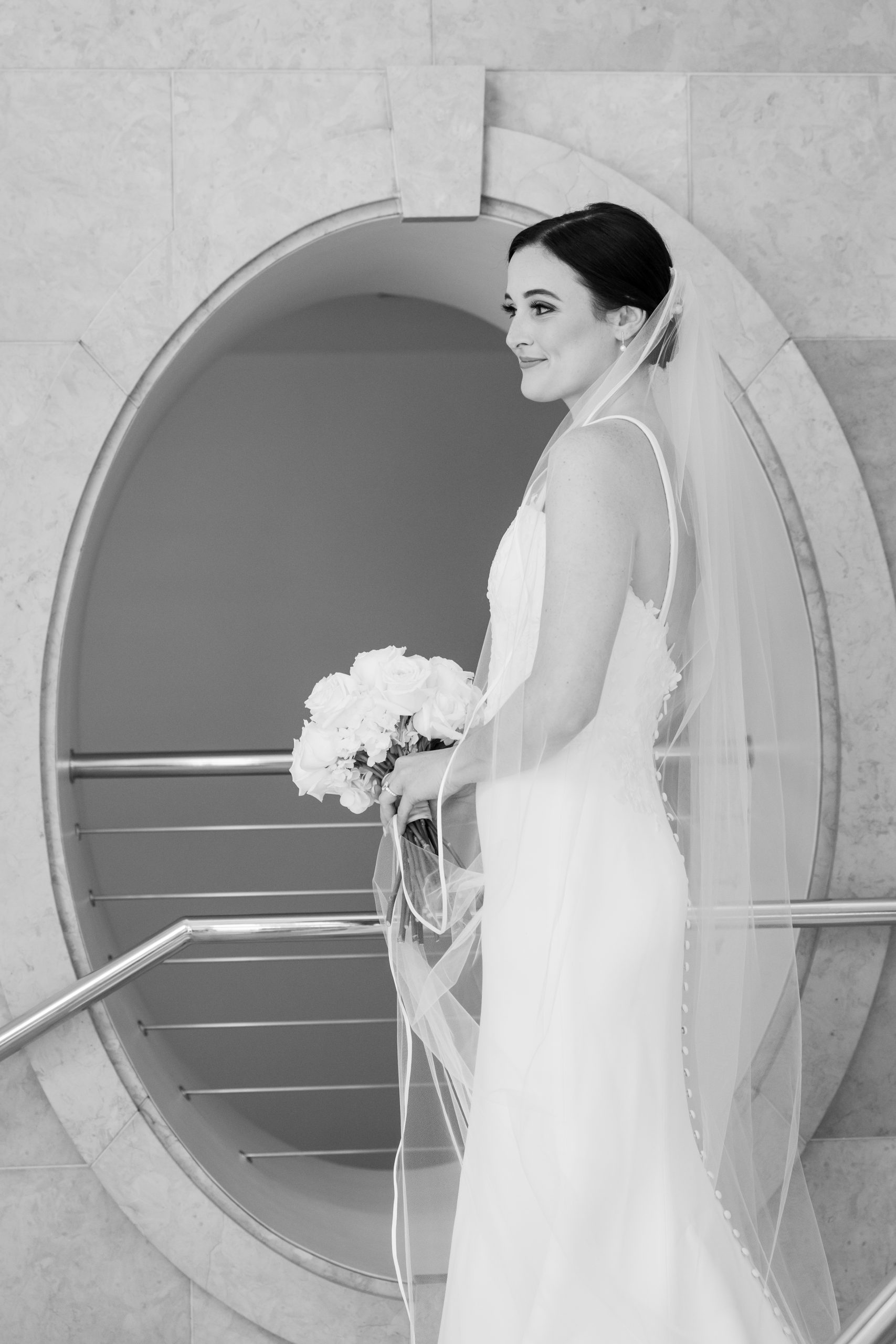 black and white bridal portrait at bass hall in Fort Worth classic and timeless by Tracy Autem with oval window