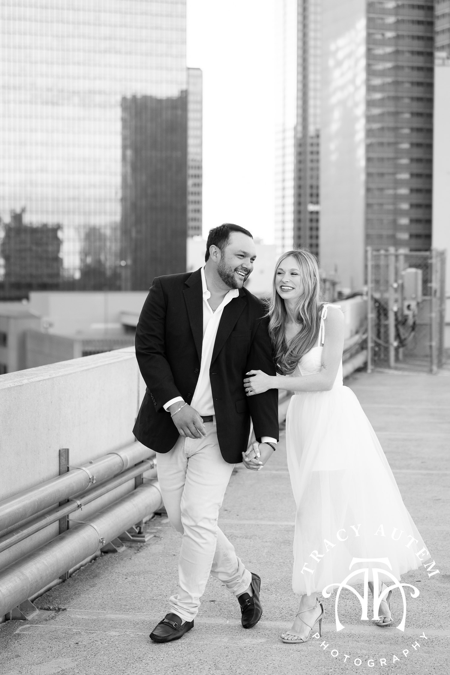 city skyline engagement portrait from parking garage in black and white