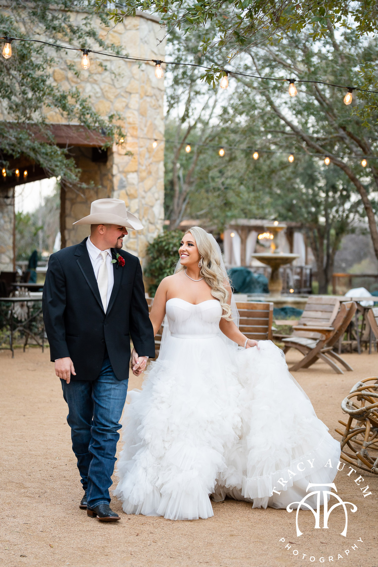 bride and groom at Hotel Drover for winter western Fort Worth wedding with photos by Tracy Autem