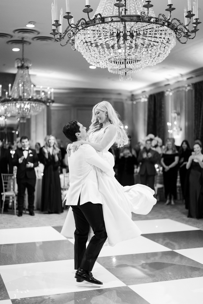 first dance at fort worth club with groom lifting bride into the air by tracy autem photography