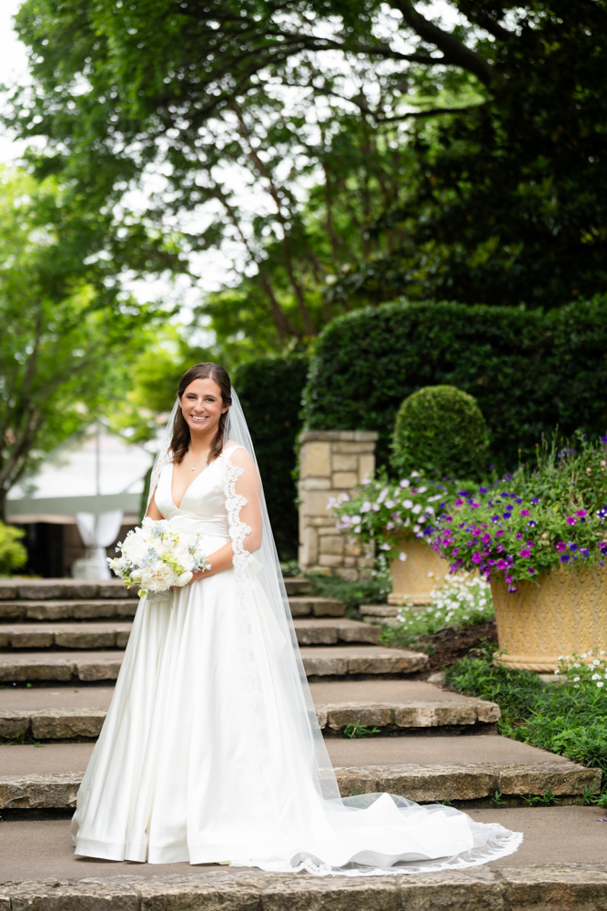 Hannah looking over her shoulder in the Dallas Arboretum gardens