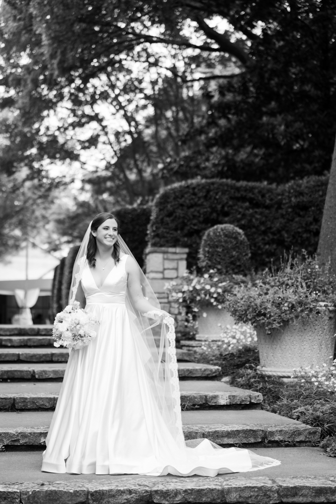 Detail of Hannah's gown and bouquet in the soft garden light