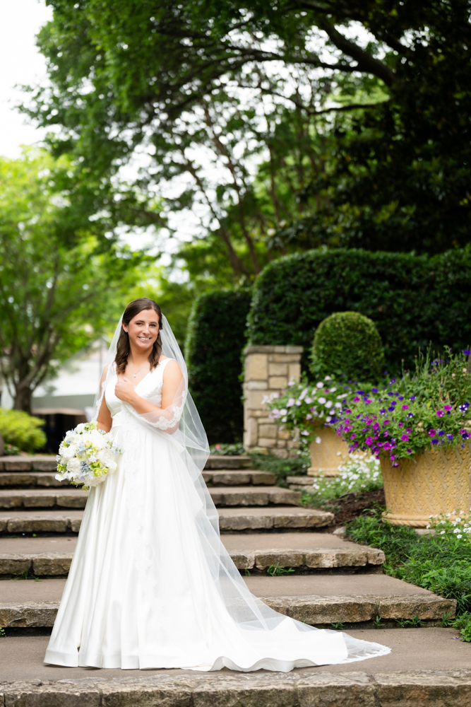 Hannah among the greenery of the Dallas Arboretum before her Dallas wedding