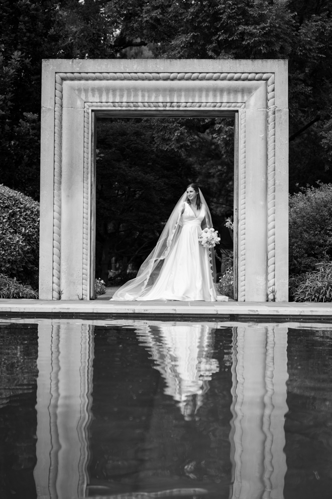 Hannah's gown and train among the greenery at the Dallas Arboretum