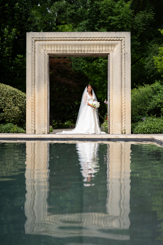 Hannah looking over her shoulder in the Dallas Arboretum gardens