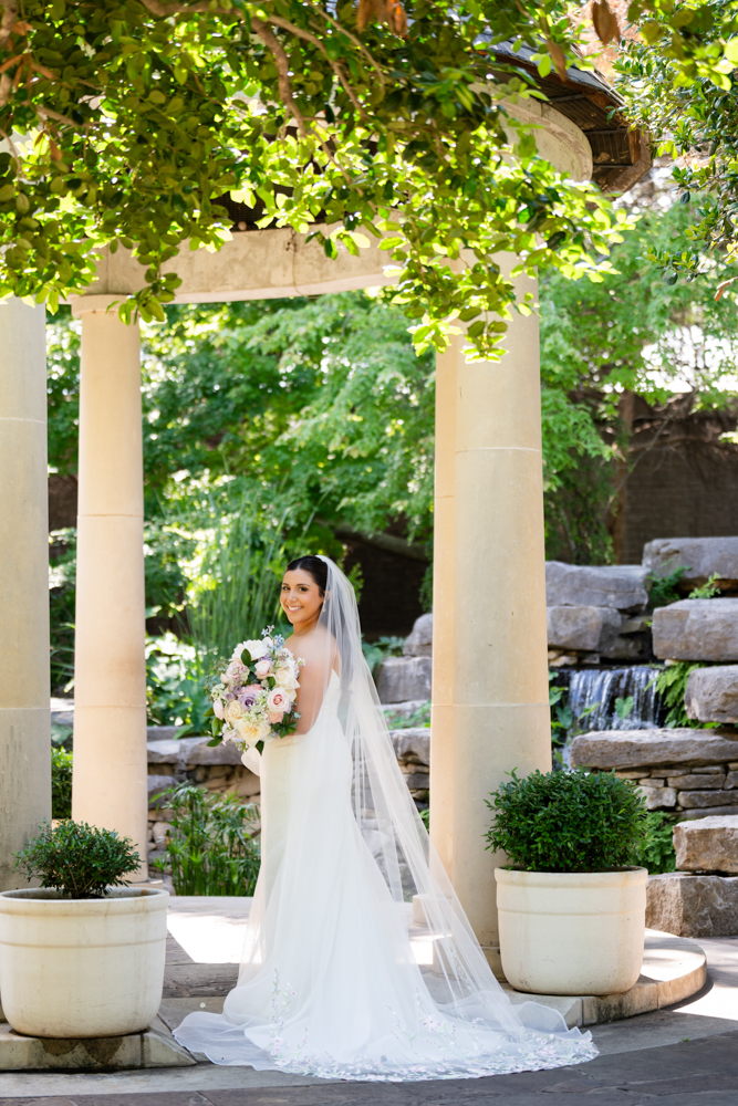 Caroline looking over her shoulder in the Fort Worth Botanic Garden