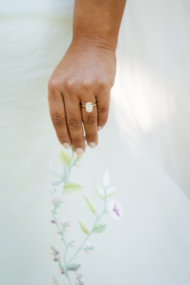 Bridal portrait of Caroline surrounded by lush garden foliage in Fort Worth