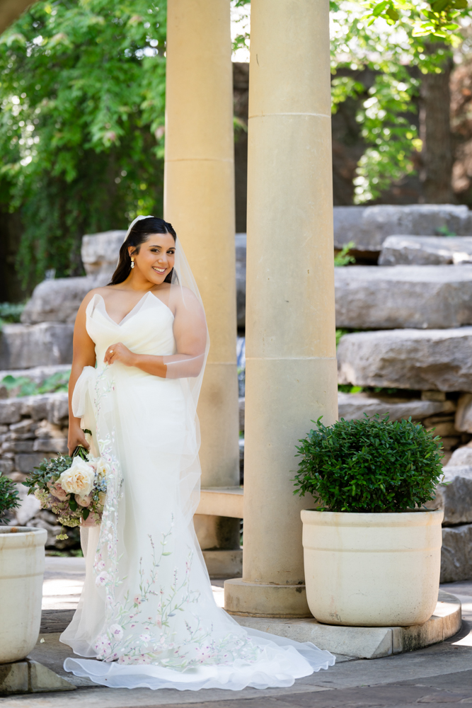 Full-length bridal portrait of Caroline in the gardens in Fort Worth