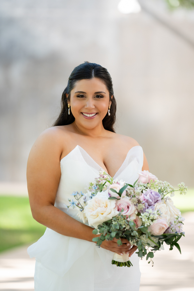 Caroline holding her TWE Floral bouquet at the Fort Worth Botanic Garden