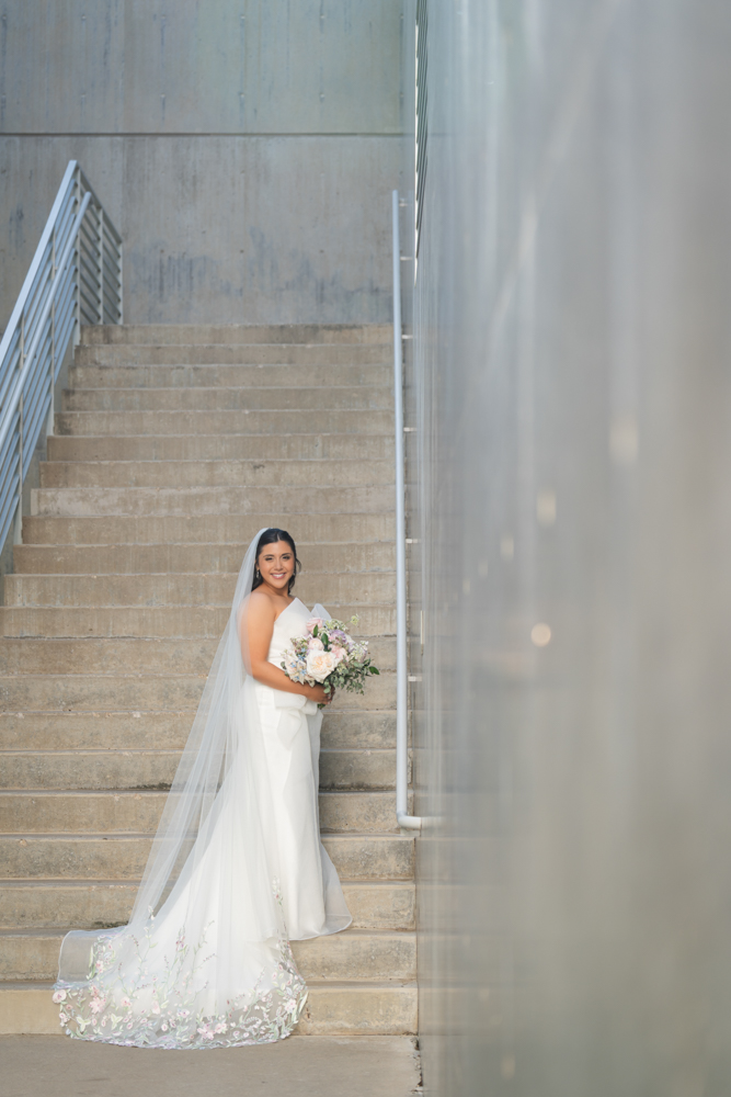 Caroline's gown against the sleek architecture of the Modern in Fort Worth