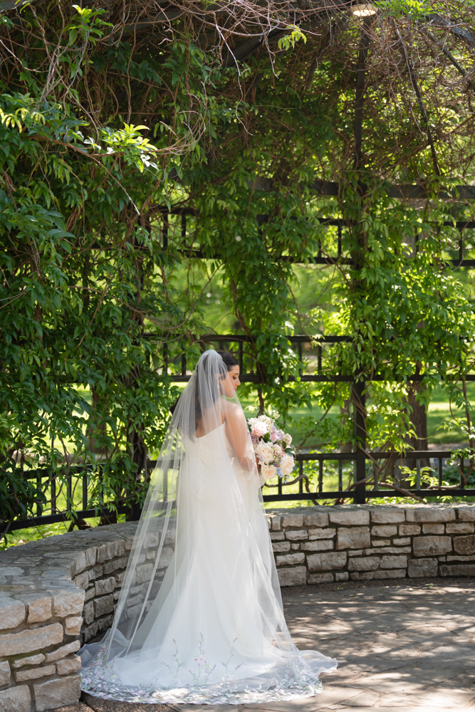 Full-length bridal portrait of Caroline in the gardens in Fort Worth