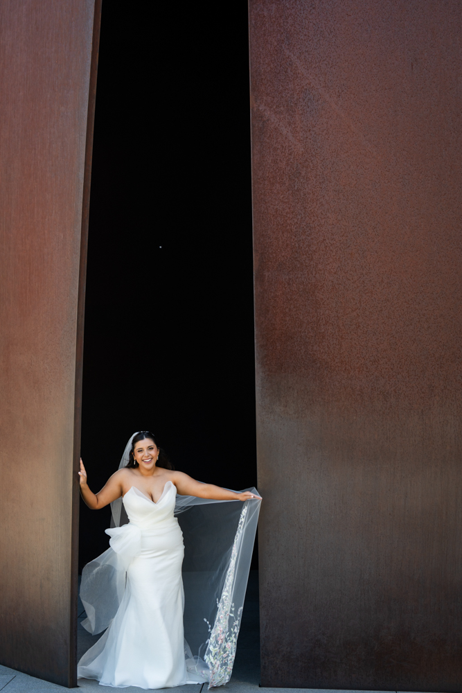 Caroline against the reflecting pool and clean walls of the Modern