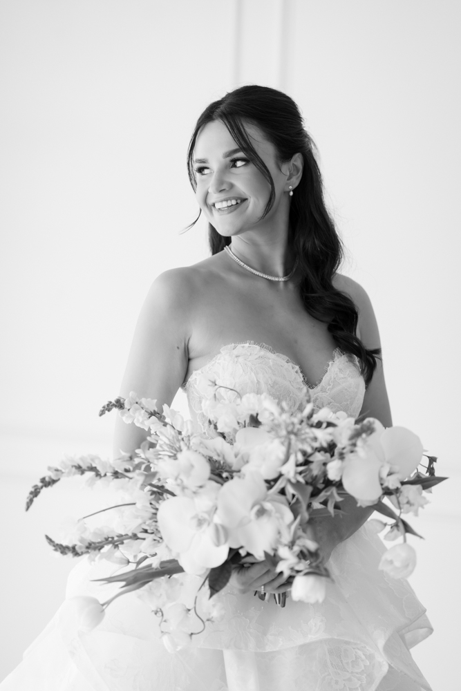 Hannah's gown and train arranged in graceful folds on the studio floor