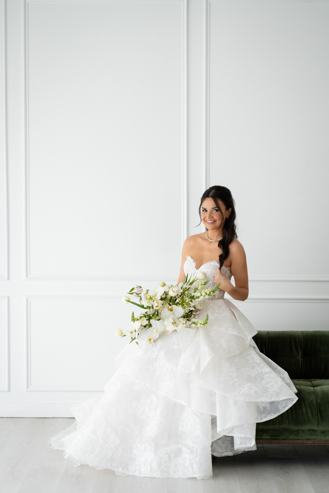 Side profile of Hannah in her gown, soft studio light tracing the fabric