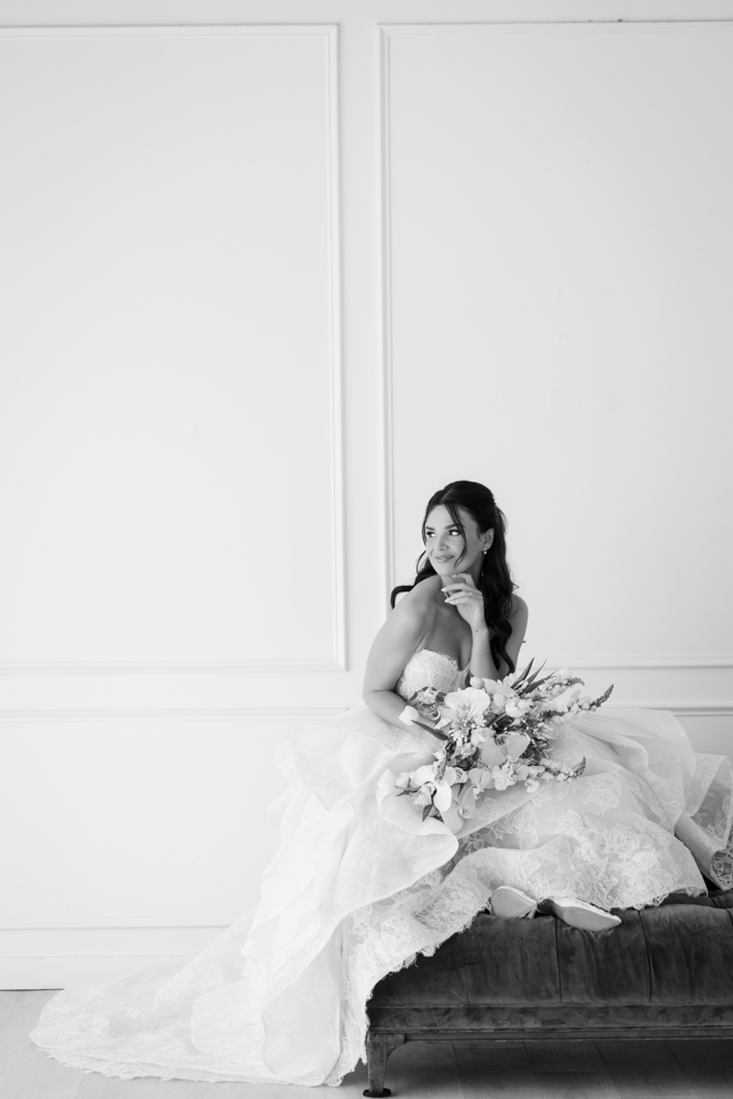 Bride Hannah framed by soft fabric and light in the Fort Worth studio