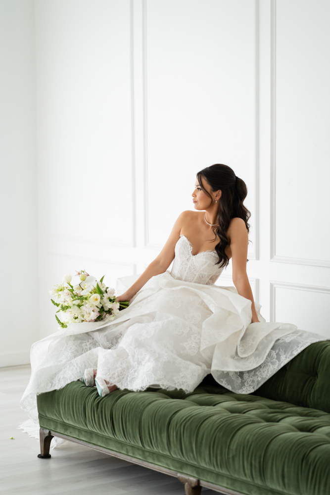 Bride Hannah in her wedding gown against a clean studio backdrop at The Lumen Room in Fort Worth