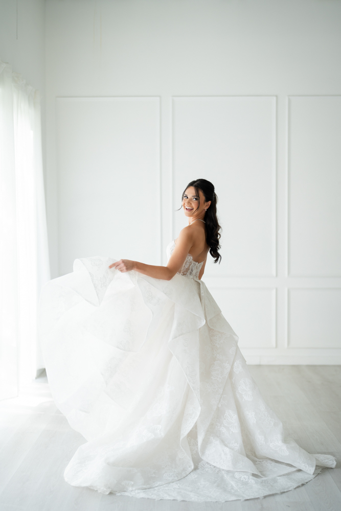 Detail of Hannah's veil drifting against a clean studio backdrop