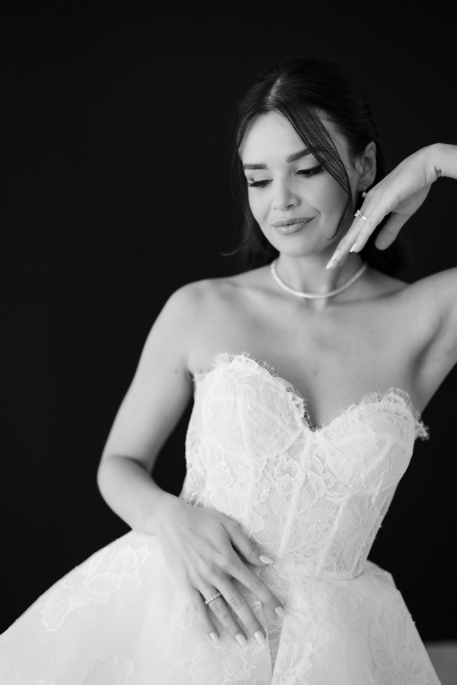 Bride Hannah framed by soft fabric and light in the Fort Worth studio