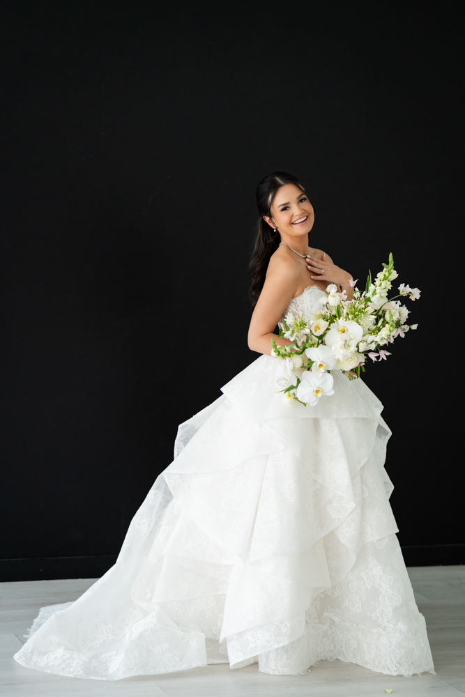 Detail of Hannah's veil drifting against a clean studio backdrop