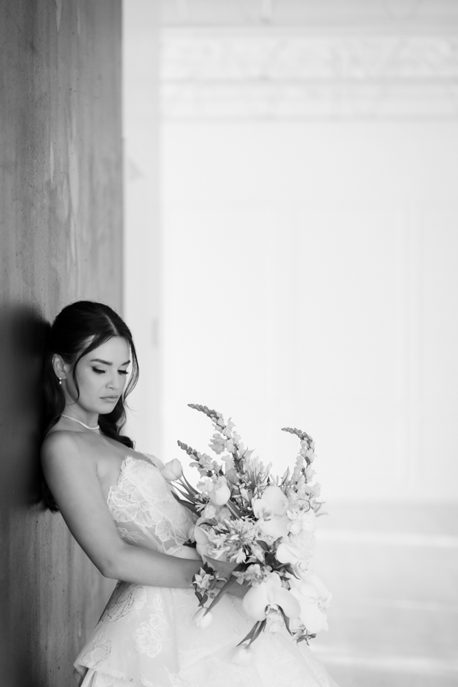 Hannah standing tall in her gown, the drapery gently framing the scene