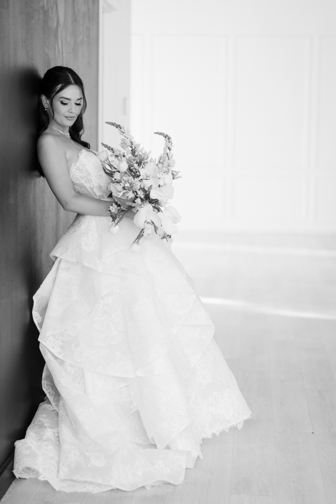 Hannah's gown and train arranged in graceful folds on the studio floor