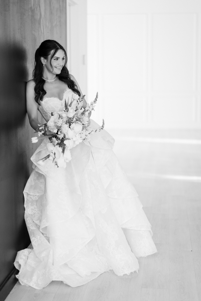 Bridal portrait of Hannah with her bouquet, clean studio lines all around