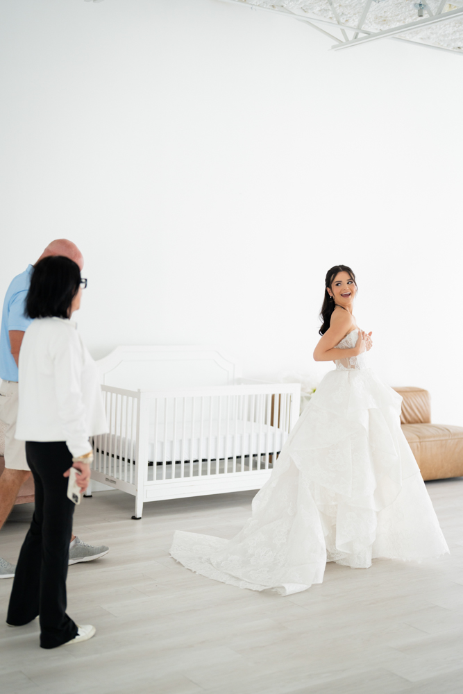 Seated bridal portrait of Hannah against a simple, uncluttered studio background