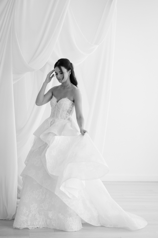 Detail of Hannah's veil drifting against a clean studio backdrop