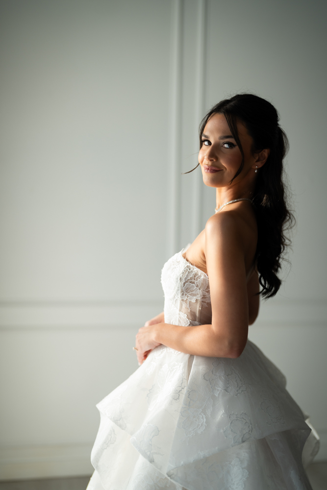 Bridal portrait of Hannah with her bouquet, clean studio lines all around
