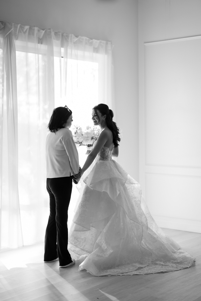 Bride Hannah framed by soft fabric and light in the Fort Worth studio