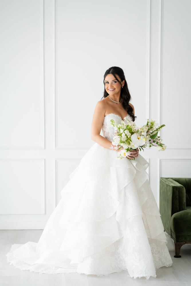 Detail of Hannah's veil drifting against a clean studio backdrop