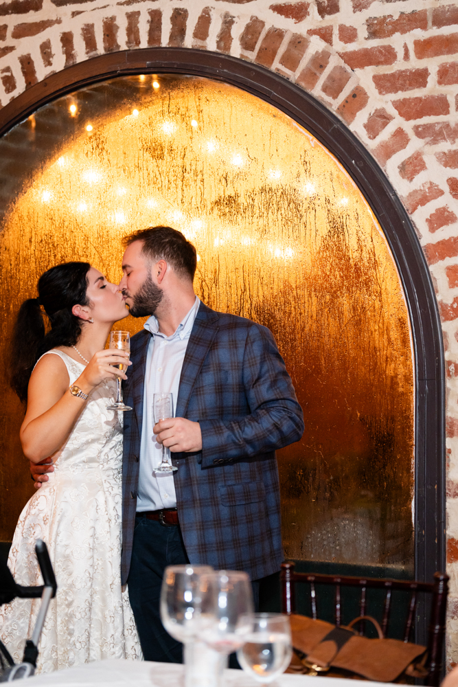 Bailey and Jay surrounded by loved ones the night before their wedding