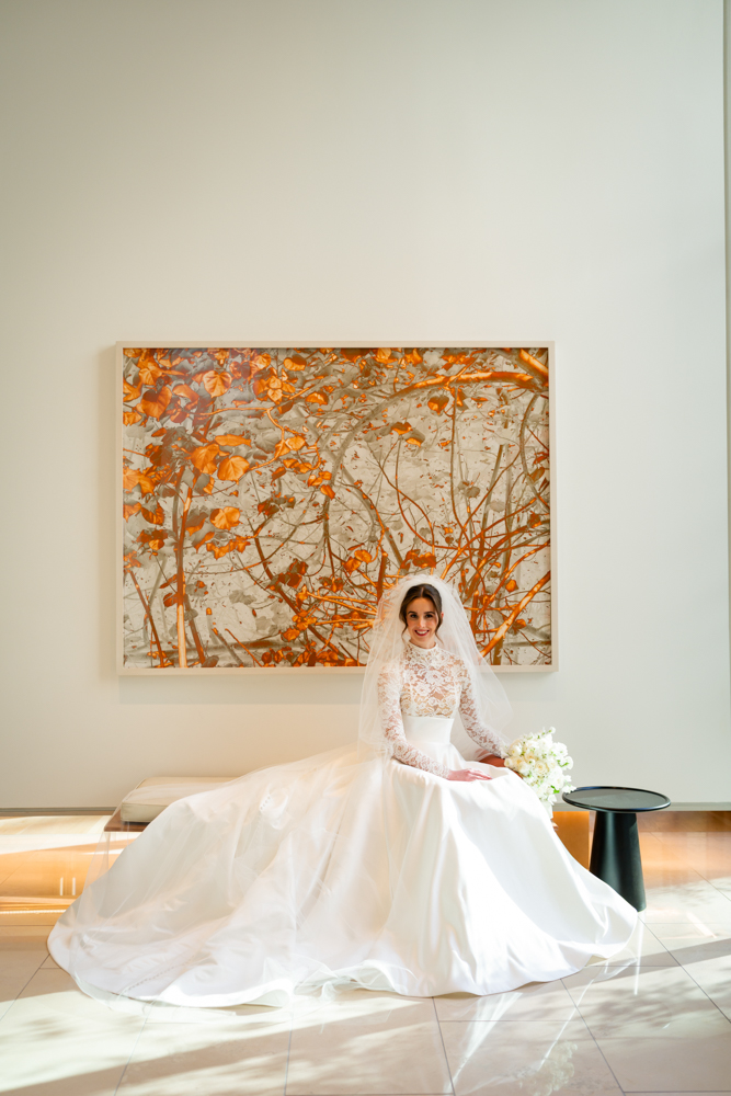 Bride seated before an amber abstract at The Crescent Hotel, Fort Worth