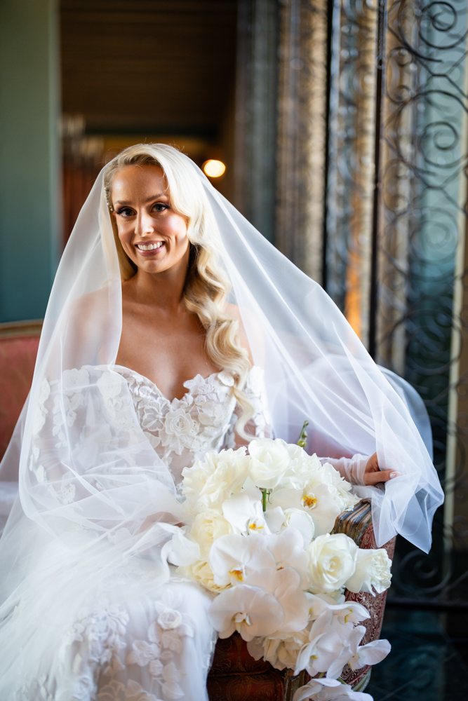 Bride smiling beneath her veil at The Fort Worth Club